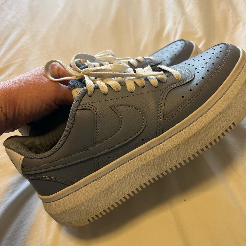 Nike Women's blue/gray platform sneakers.